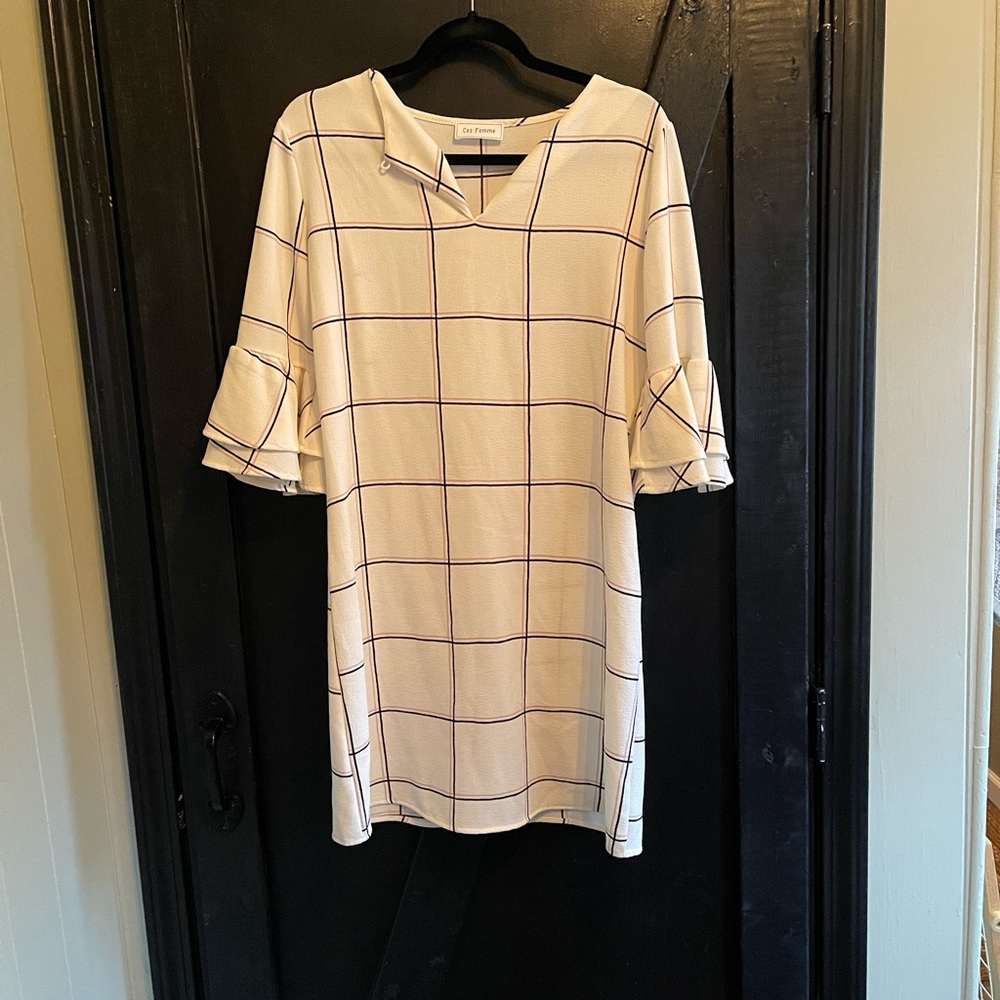 Black and cream ruffled sleeve tunic or dress.